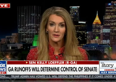 Senator Kelly Loeffler during live shot interview on Fox News in front of background image of the Atlanta skyline at night