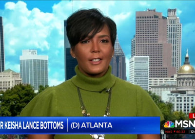 Mayor Keisha Lance Bottoms in front of image of Atlanta skyline that includes the Capitol building for MSNBC Live